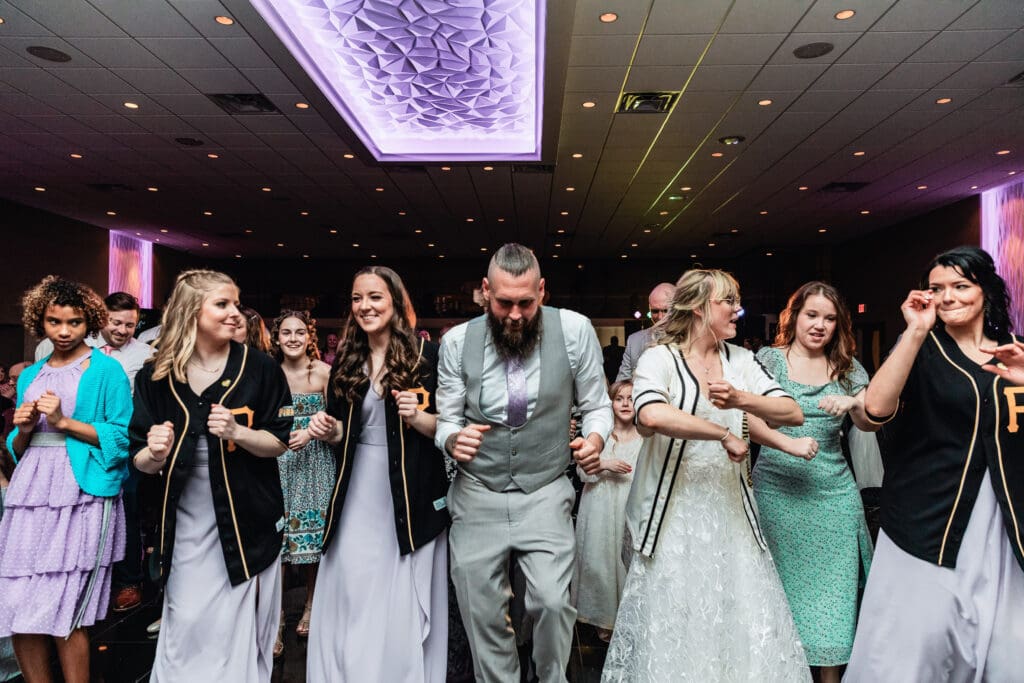 People dancing and celebrating at a wedding reception at The Fez
