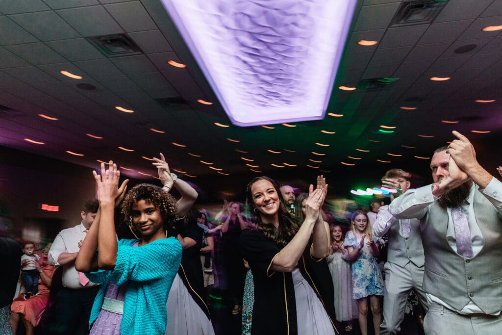 Wedding guests dancing and celebrating on the dance floor at The Fez