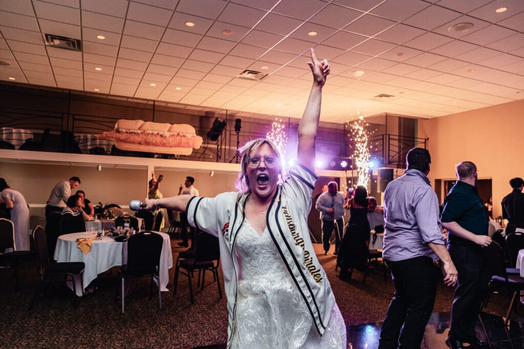 Bride jumps joyfully amid cheering crowd at The Fez