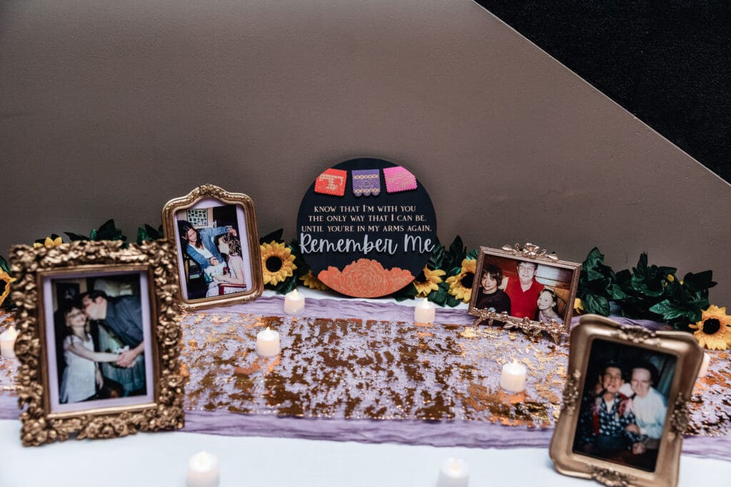 Wedding memorial display with framed photographs and soft lighting at The Fez
