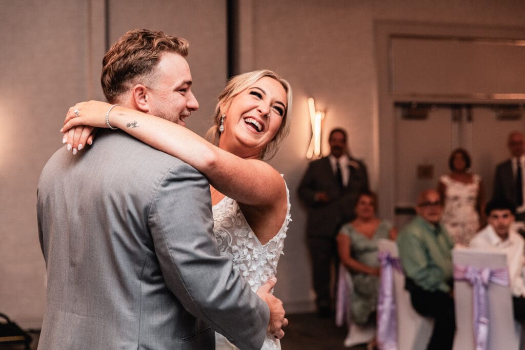 Bride and groom laughing during their first dance at Pittsburgh Airport Marriott reception