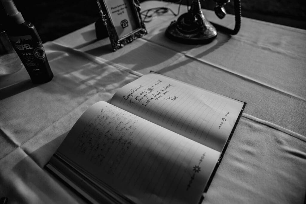 Black and white photo of wedding guest book at Succop Nature Park wedding