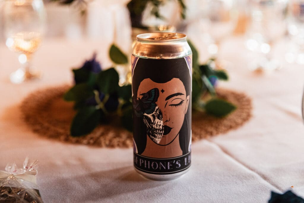 Close-up of beer called Persephone's Dream at Succop Nature Park wedding reception