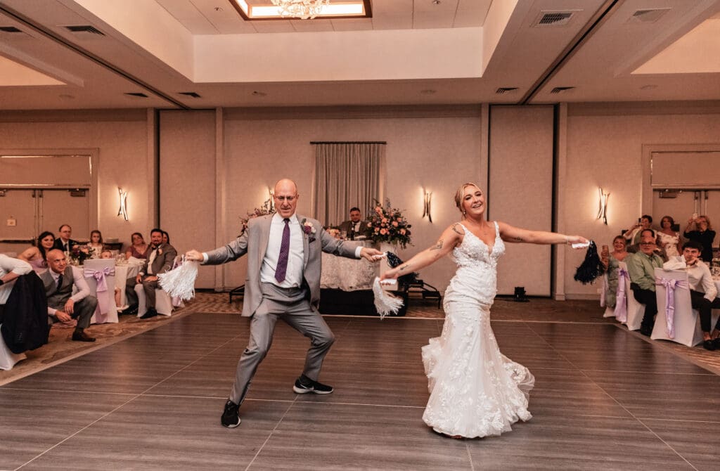 Bride and dad laughing during choreographed dance at Pittsburgh Airport Marriott reception