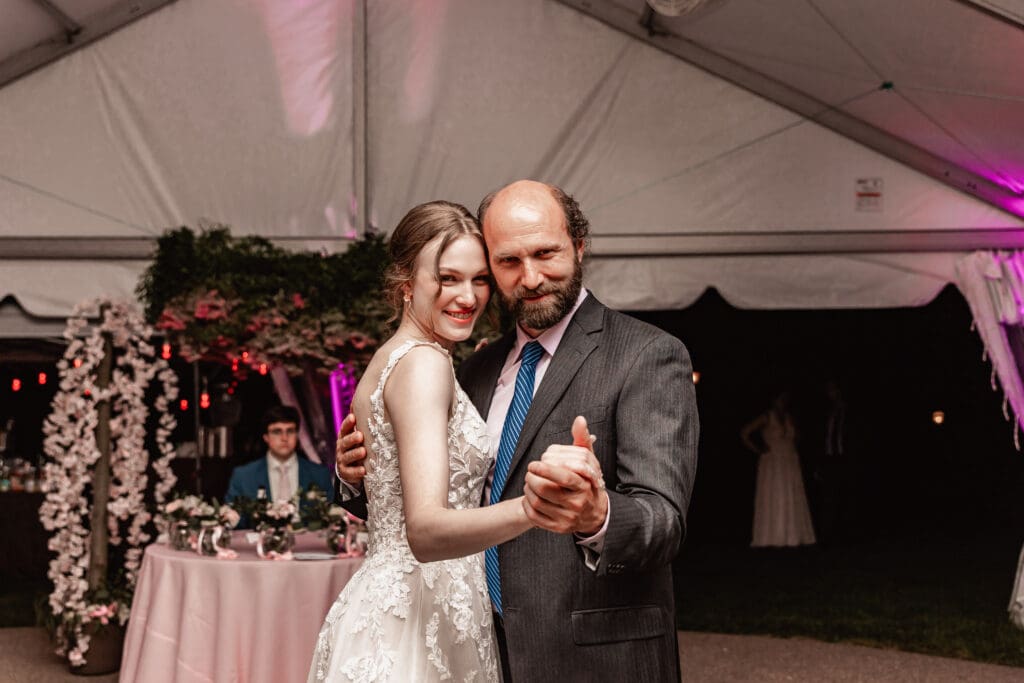Father and bride dancing together during a Phipps Botanical Gardens wedding reception in Pittsburgh