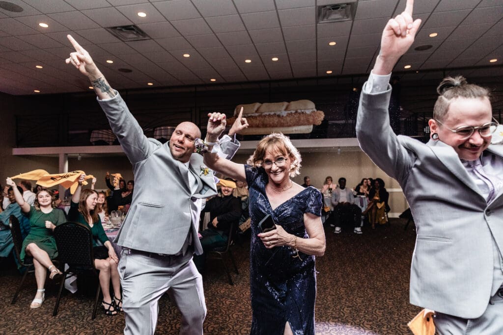 Bride’s family makes a joyful grand entrance during the wedding reception at The Fez