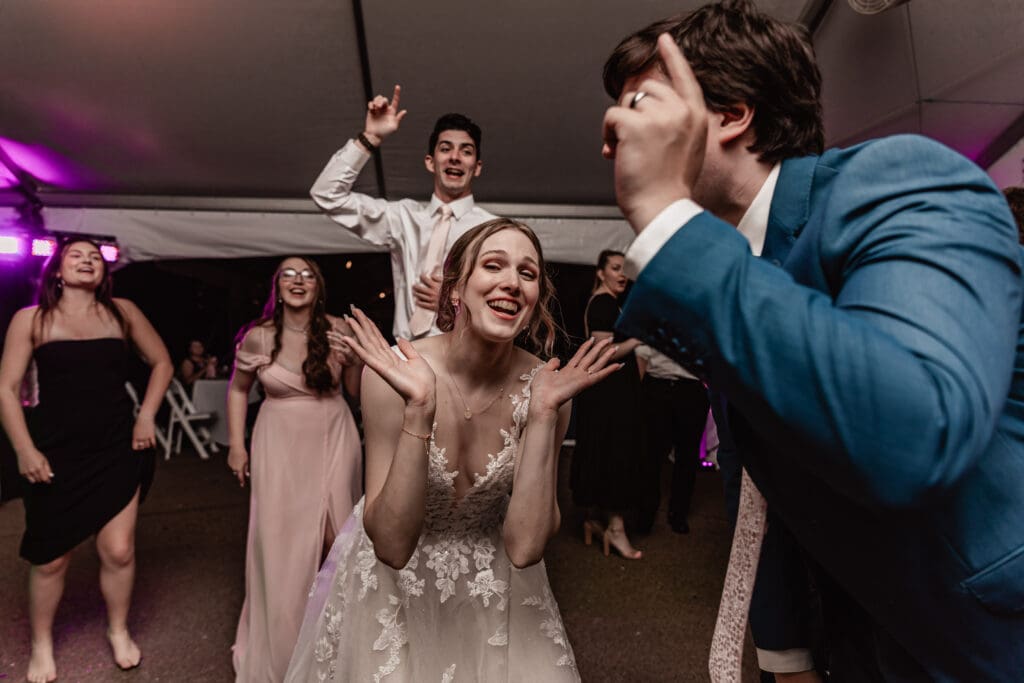 Pittsburgh bride dancing and laughing with guests at her Phipps Botanical Gardens wedding reception