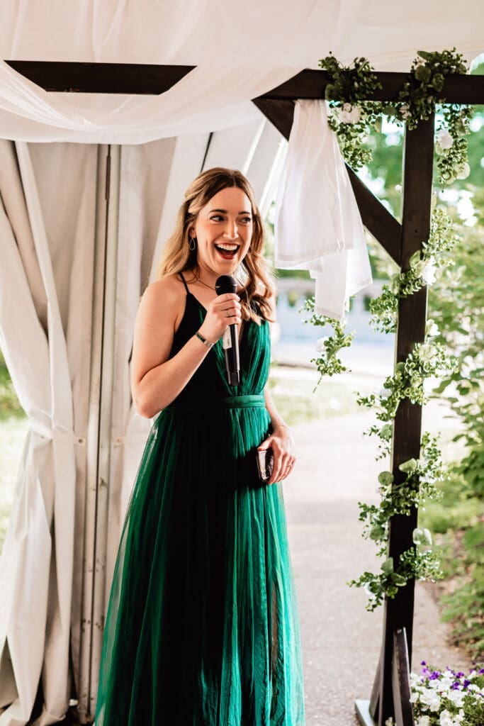 Bride’s sister smiles tenderly at her mother while giving a speech during the Schenley Park Welcome Center reception in Pittsburgh