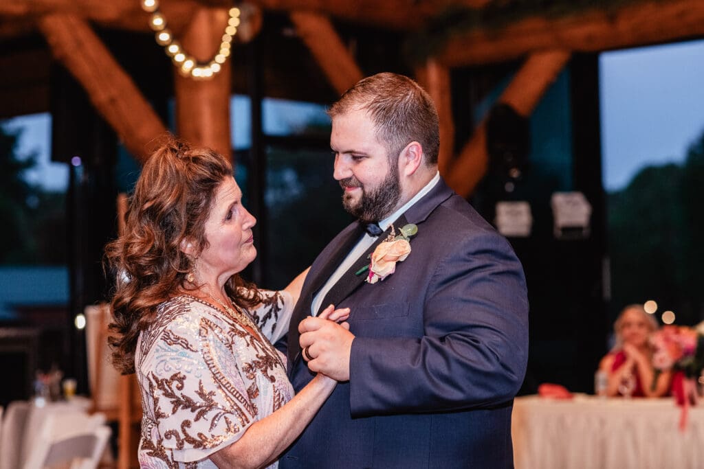 Groom dancing with his mother during wedding reception at The Gathering Place at Darlington Lake