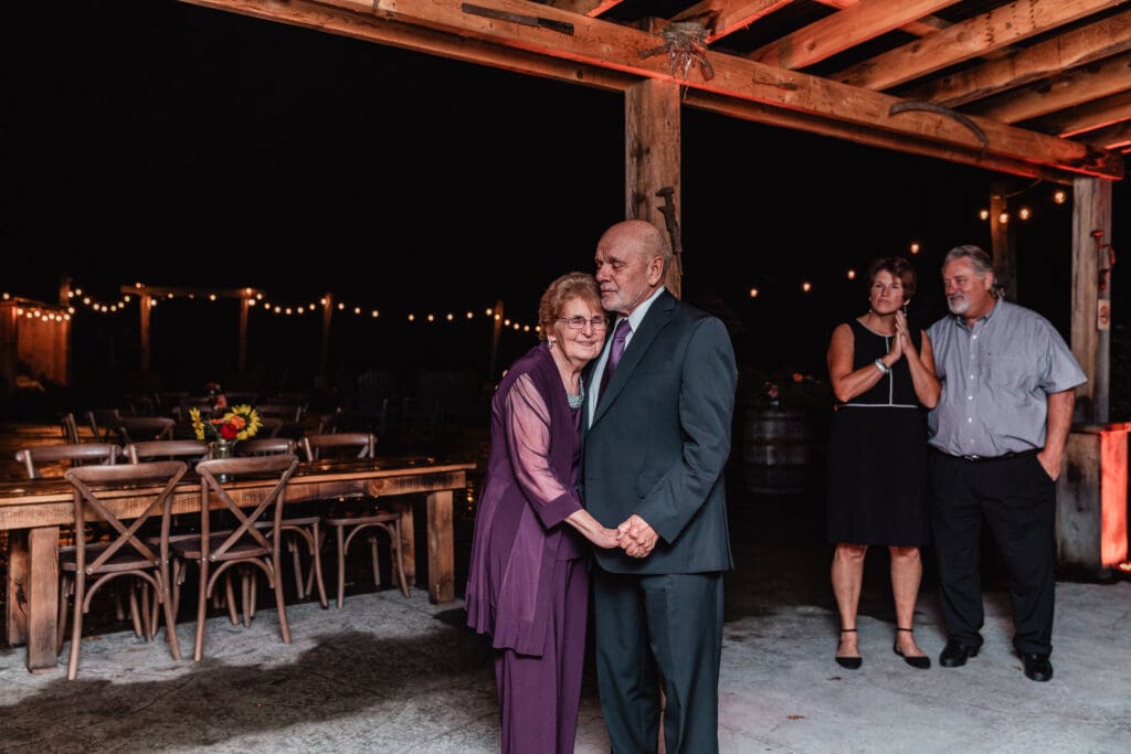 Couples sway together on the dance floor at Hinckston Run Farm barn reception