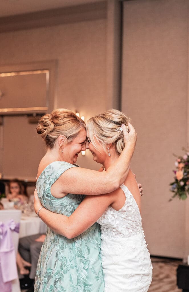 Bride and mother share emotional embrace during dance at Pittsburgh Airport Marriott reception