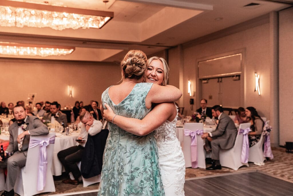 Bride and her mother sharing a joyful moment during their dance at Pittsburgh Airport Marriott wedding reception