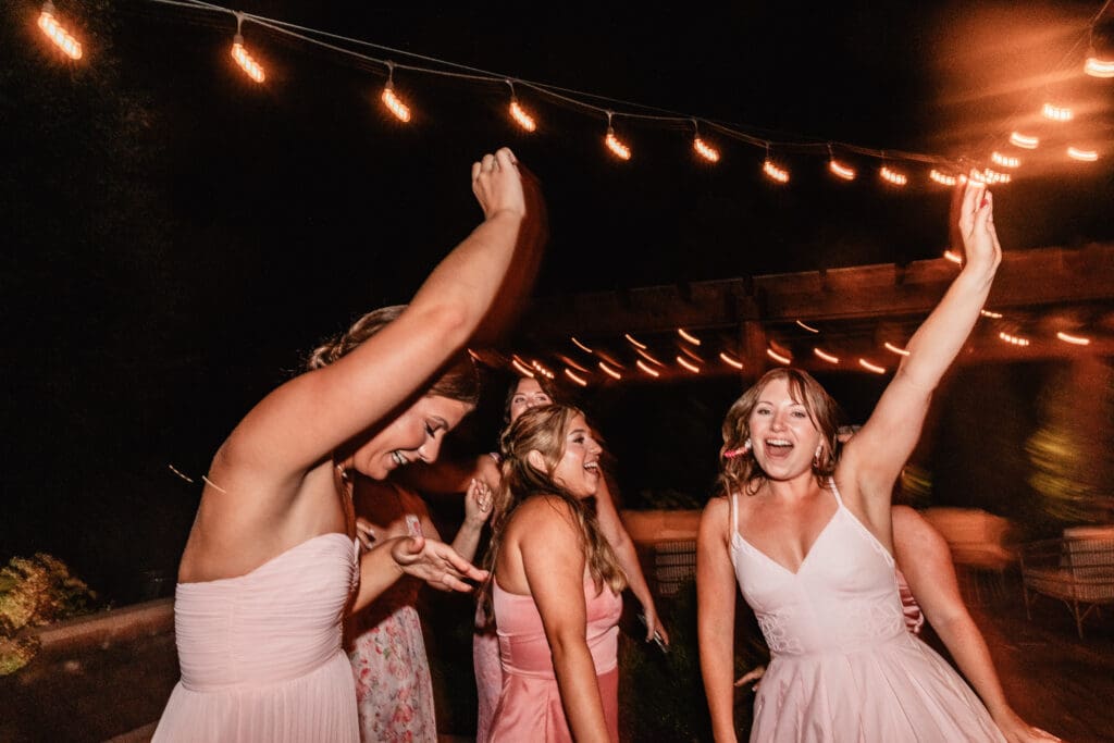 Shutter drag photo of guests dancing at a lively Willowbrook wedding reception in Volant, Pennsylvania