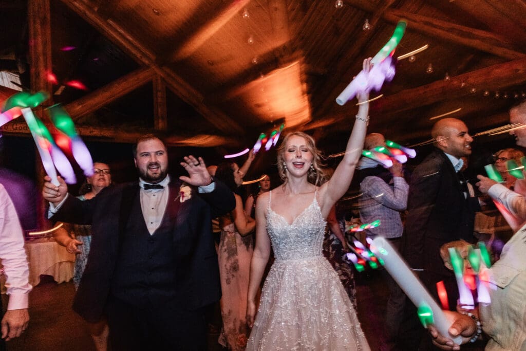 Bride and groom dancing with wedding guests at The Gathering Place at Darlington Lake reception