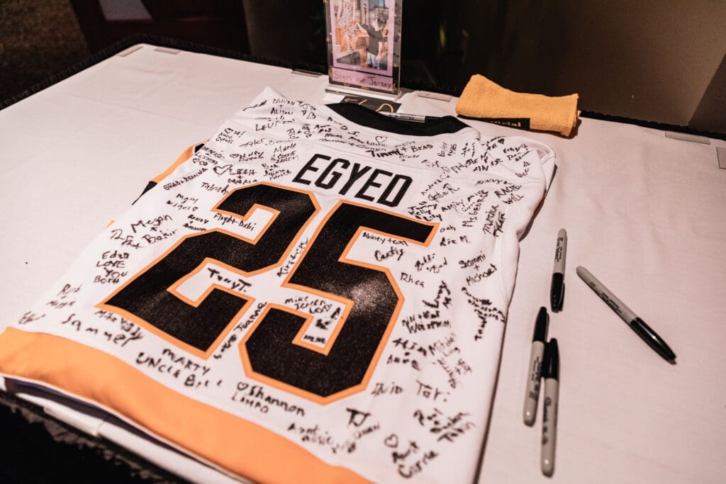 Signed sports jersey displayed as a wedding detail at The Fez