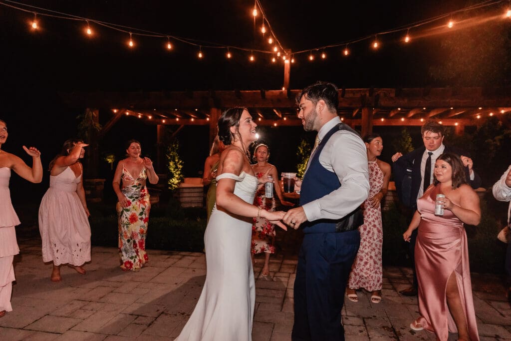 Pittsburgh couple laughs and dances together during their wedding reception at Willowbrook in Volant, Pennsylvania