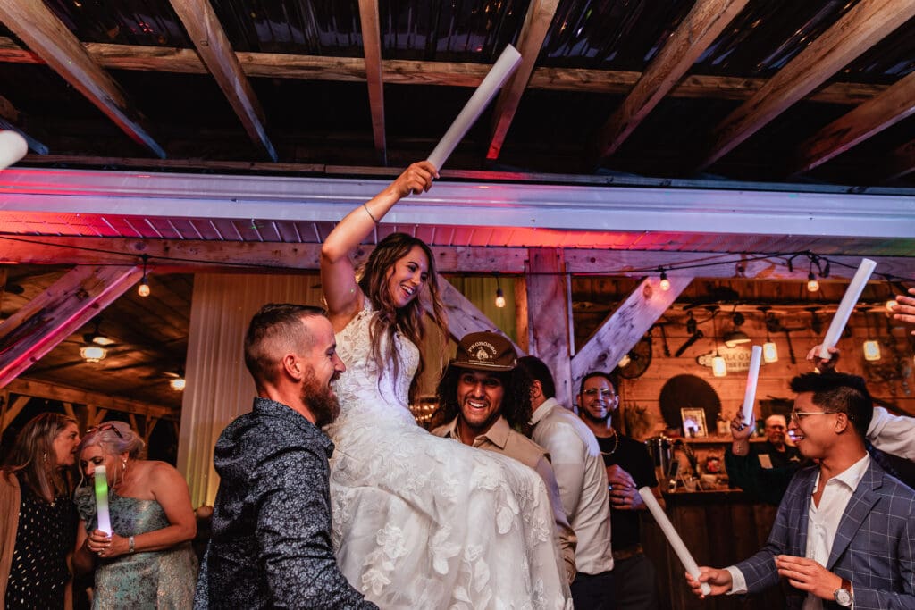 Wedding couple raised on chairs amid cheering guests at Hinckston Run Farm