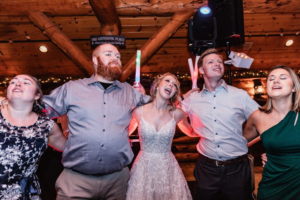 Newlyweds dancing surrounded by friends and family at The Gathering Place at Darlington Lake