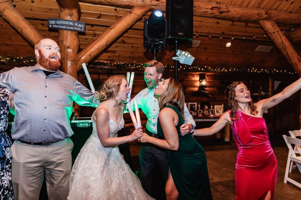 Bride and groom celebrating on dance floor with guests at The Gathering Place at Darlington Lake