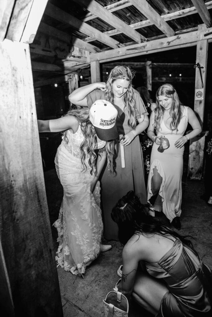 Black and white wedding photos showing guests dancing and celebrating at Hinckston Run Farm reception