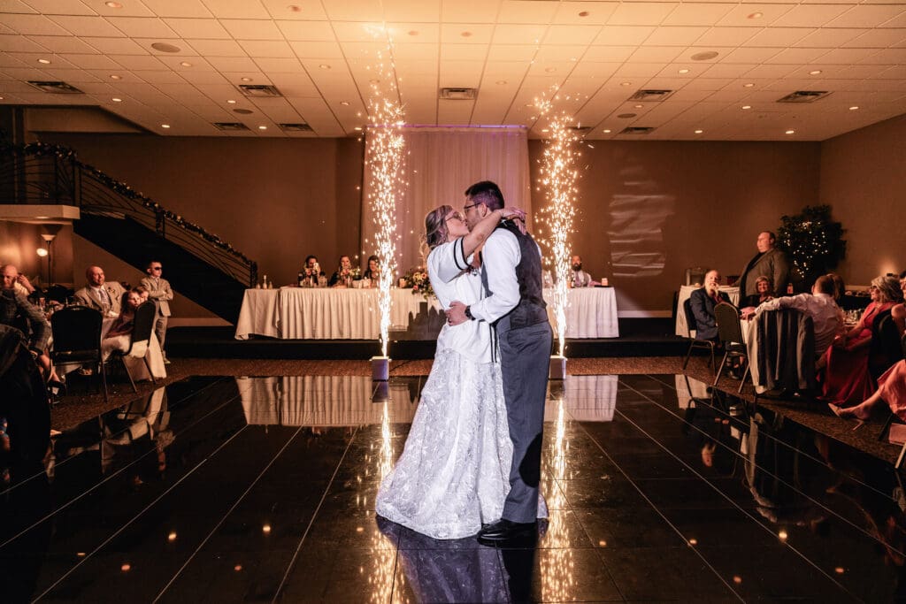 Couple shares an intimate dance in dimly lit reception hall at The Fez