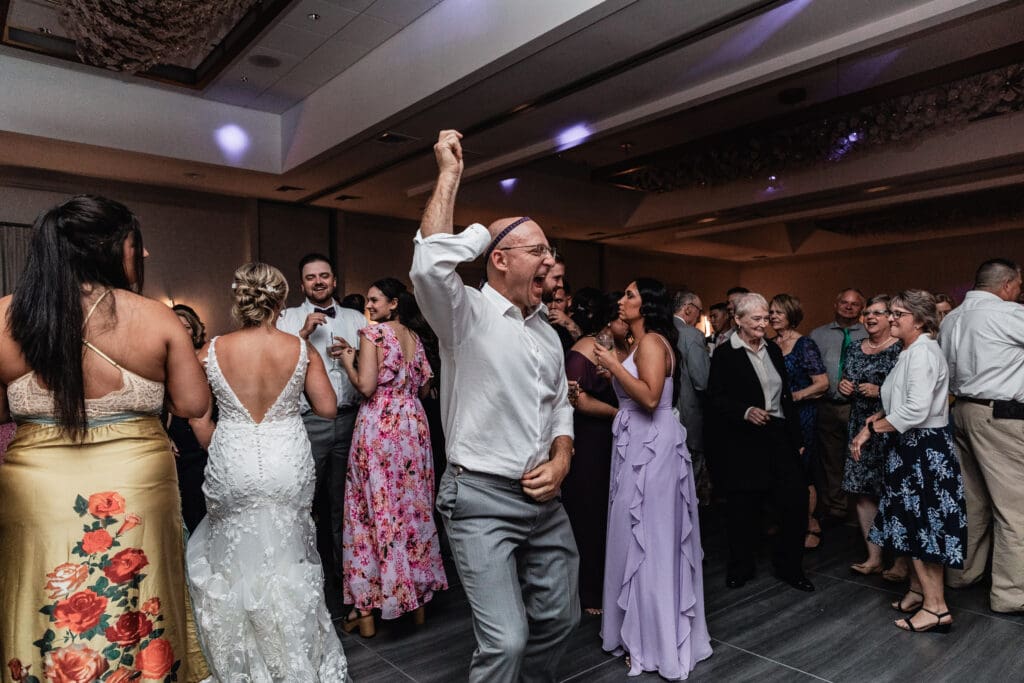 Father of the bride dancing and celebrating at Pittsburgh Airport Marriott reception