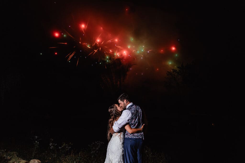 Couple shares a quiet moment while watching fireworks at Hinckston Run Farm