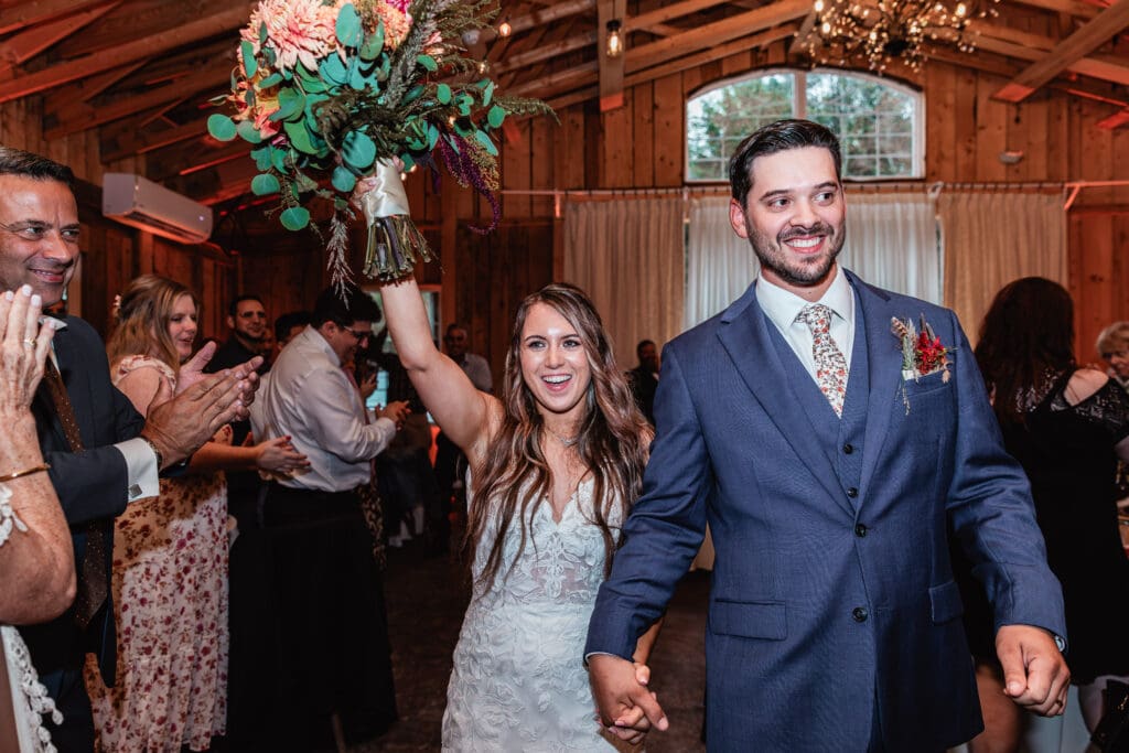 Wedding couple makes their grand entrance at Hinckston Run Farm reception