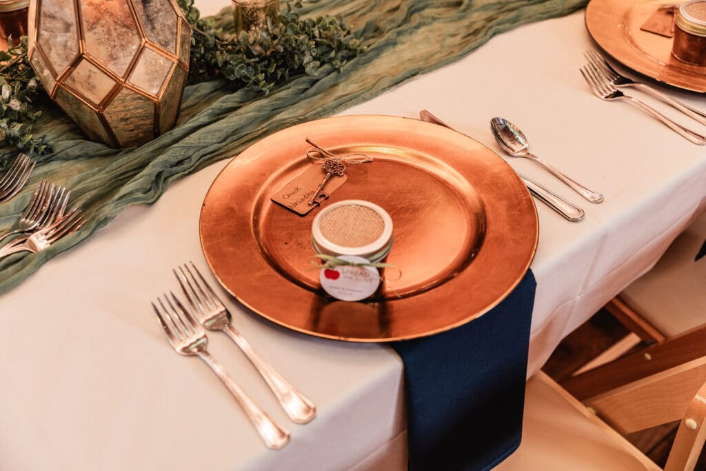 Overhead view of wedding place setting at Pinehall at Eisler Farm reception