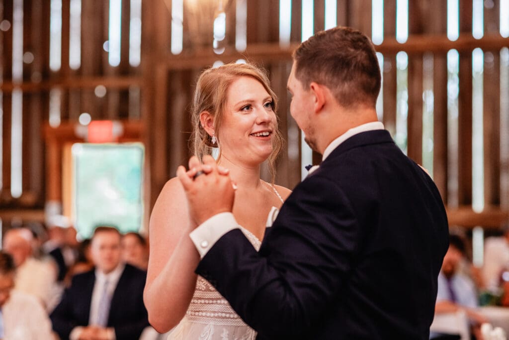 Bride and groom sharing their first dance during the wedding reception at The Barn at Ever Thine in Butler County, Pennsylvania