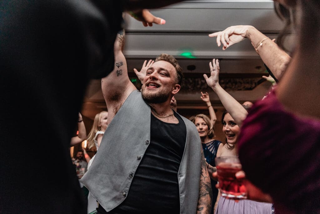 Groom dancing and celebrating during Pittsburgh Airport Marriott wedding reception