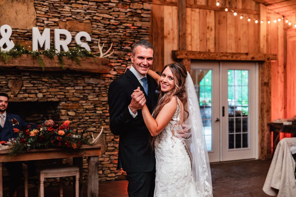 Bride dances with her dad during rustic Hinckston Run Farm reception