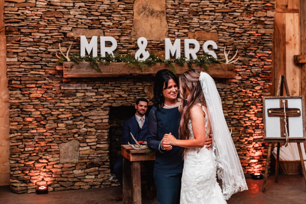Bride dances with her mom during wedding reception at Hinckston Run Farm