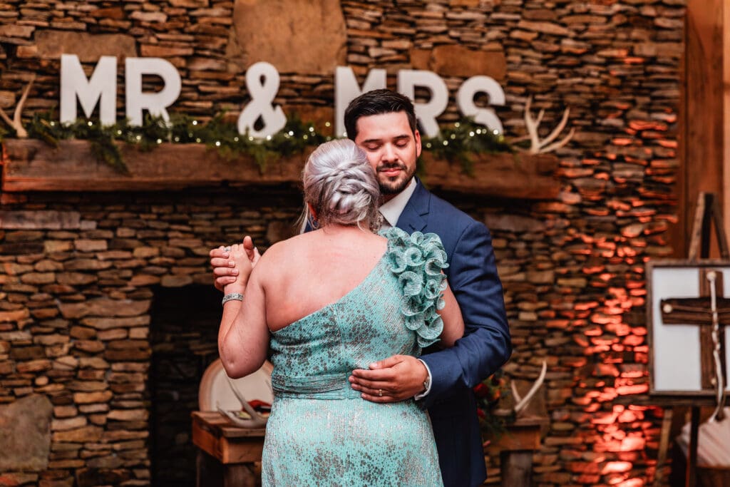 Groom dances with his mother during Hinckston Run Farm reception