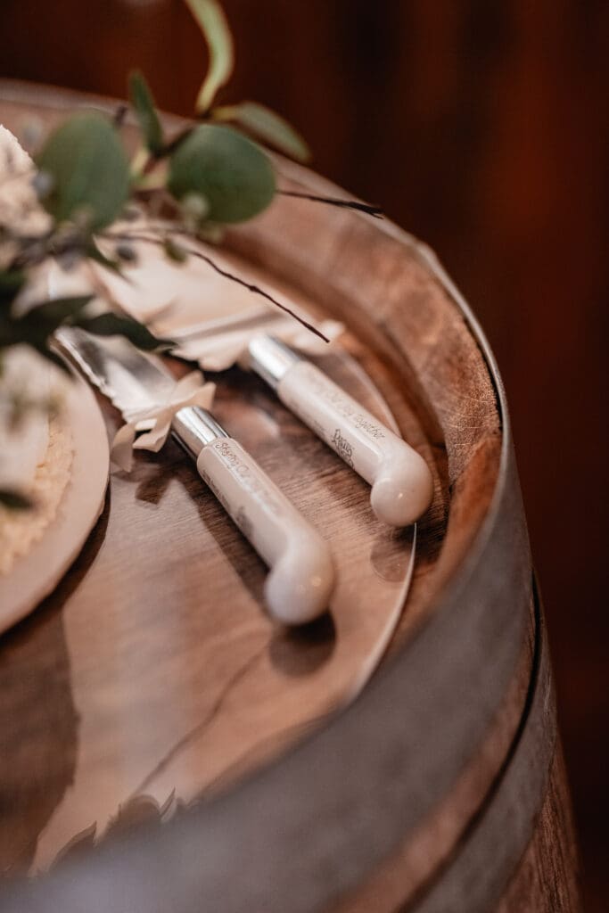 Close-up of cake cutting utensils styled for a wedding at The Barn at Ever Thine in Fenelton, Pennsylvania