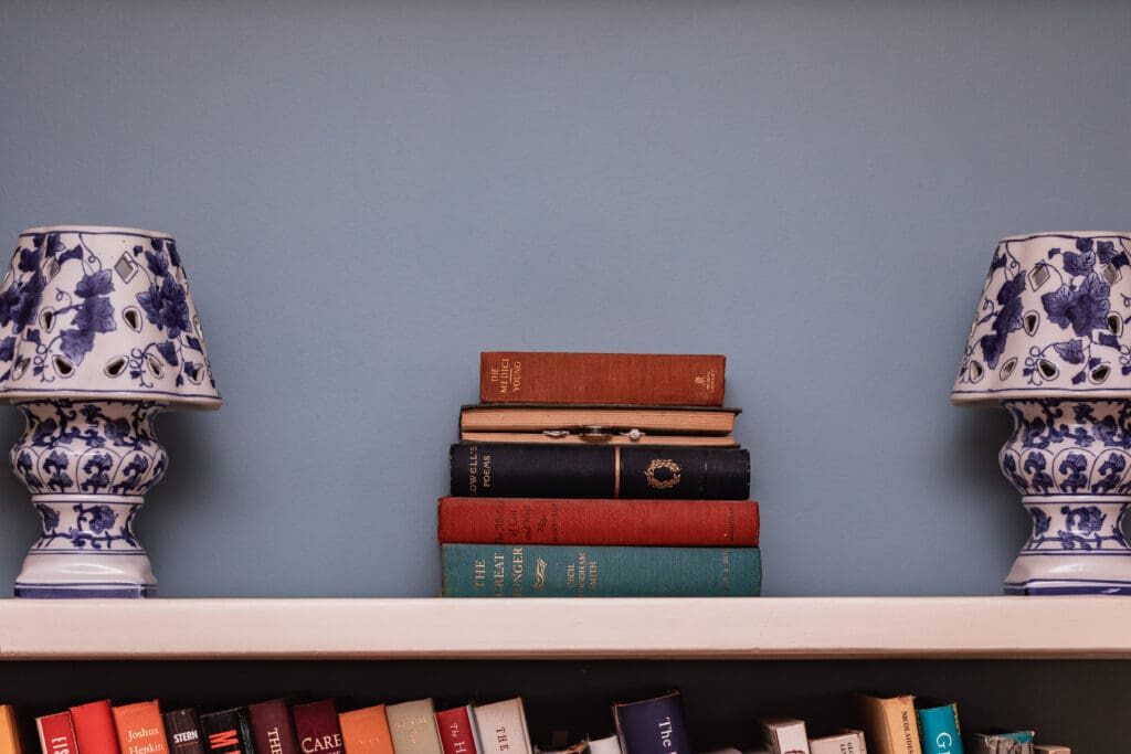 Wedding rings posed on vintage books during Succop Nature Park wedding