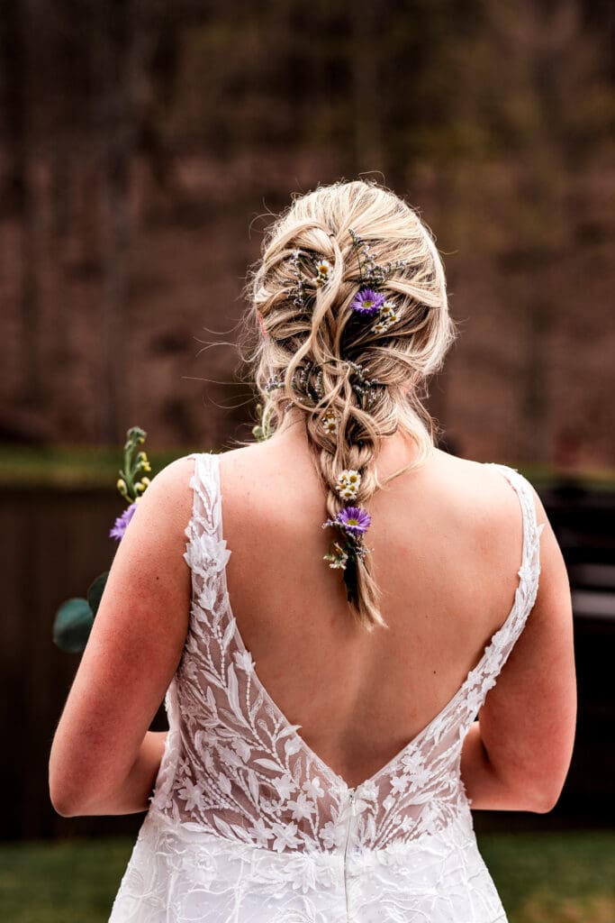 Back view of bride in lace wedding dress with braided hairstyle at The Fez