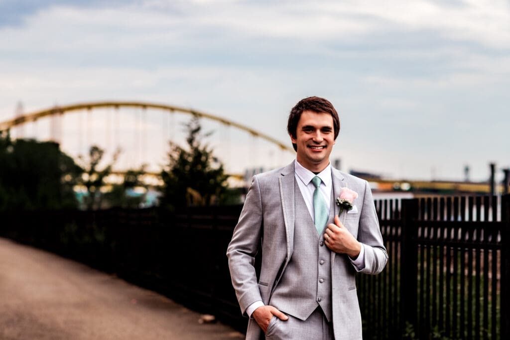 Groom poses for wedding photos at Sheraton Station Square
