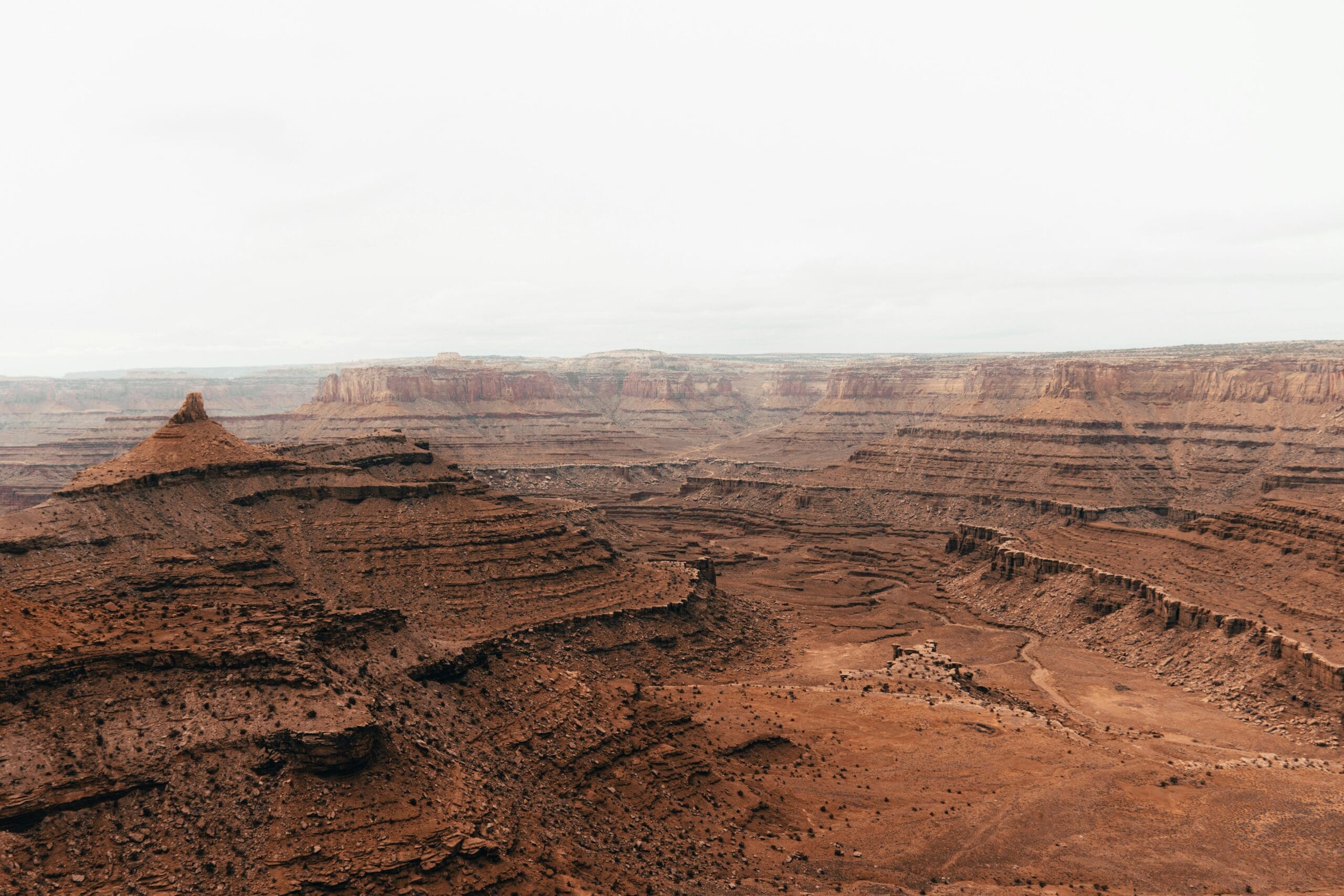 Iconic view of the Colorado River bend from Dead Horse Point State Park in Moab, Utah surrounded by towering canyon walls and expansive desert scenery
