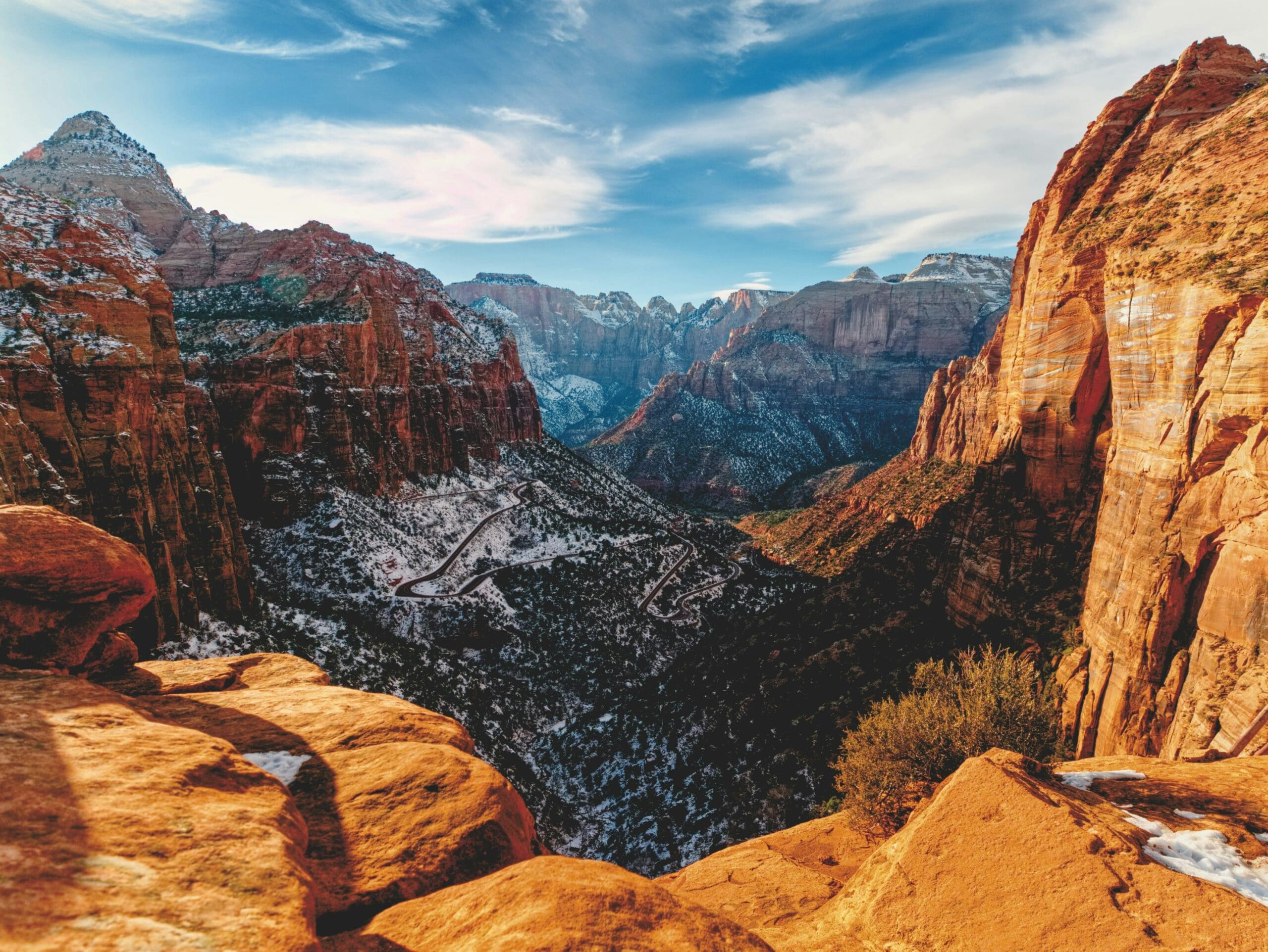 Snow-dusted red rock cliffs in Zion National Park during winter