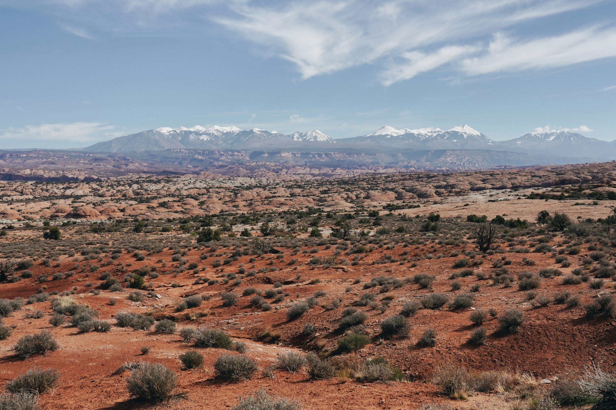 La Sal Mountains Utah elopement location with pine forests, alpine peaks, and distant desert views near Moab.