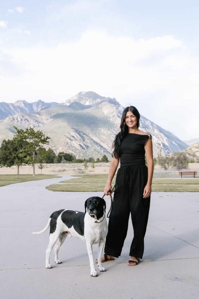 Professional portrait of a Utah dog wedding attendant from Walks of Love who partners with a Utah elopement photographer to help couples include their dogs during Moab elopements with stress-free pet care.